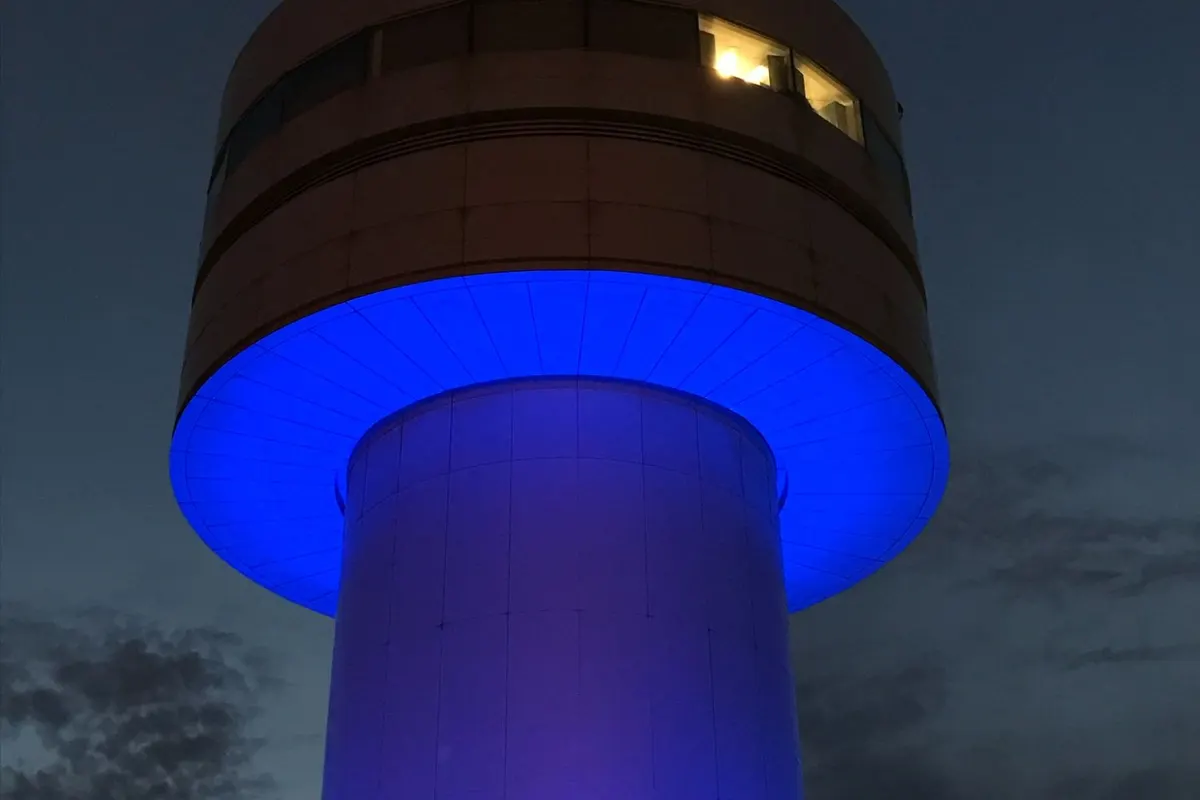 Pearson Airport Apron Tower illuminated in blue for Rare Disease Day