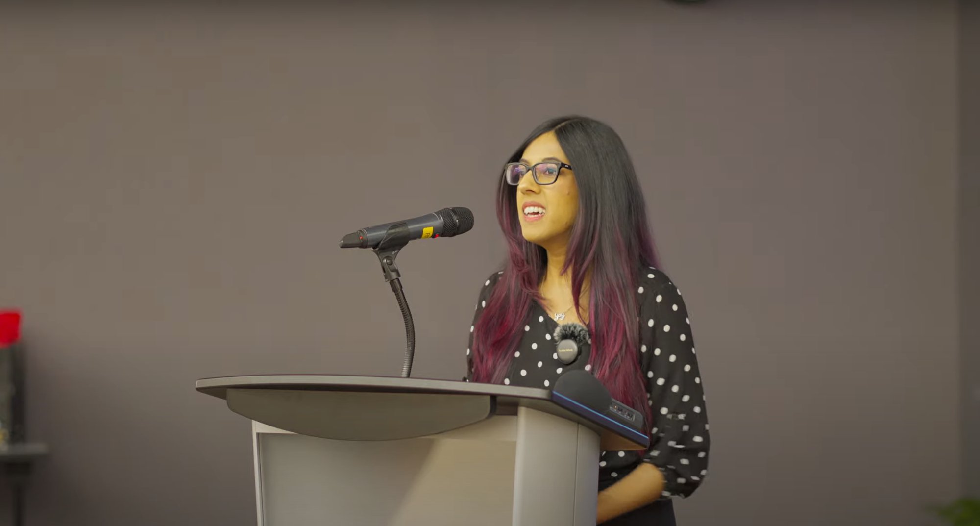 Lauren Pires speaking at podium